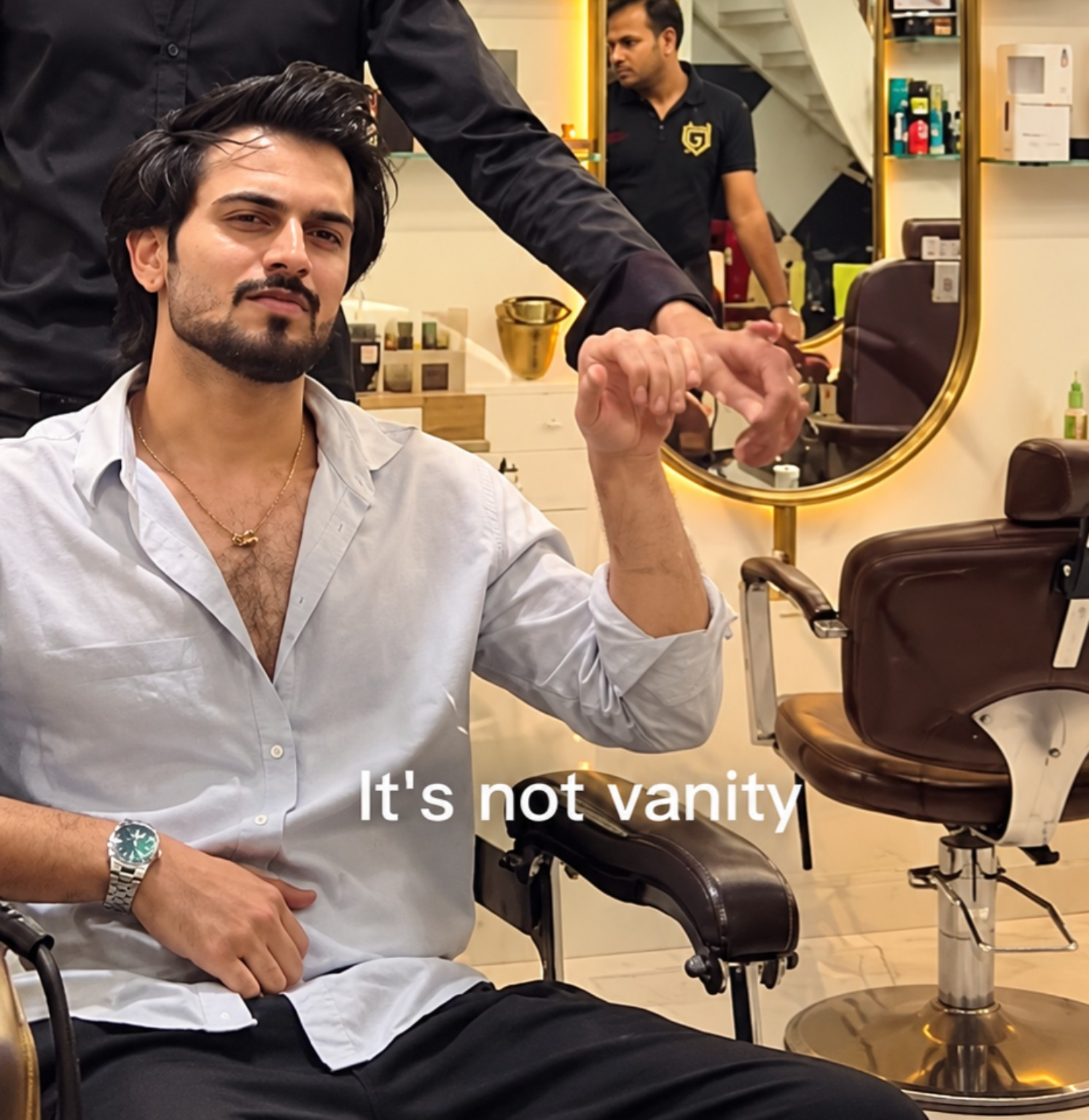 Man in a white shirt at Laséa Salon with It's not vanity text